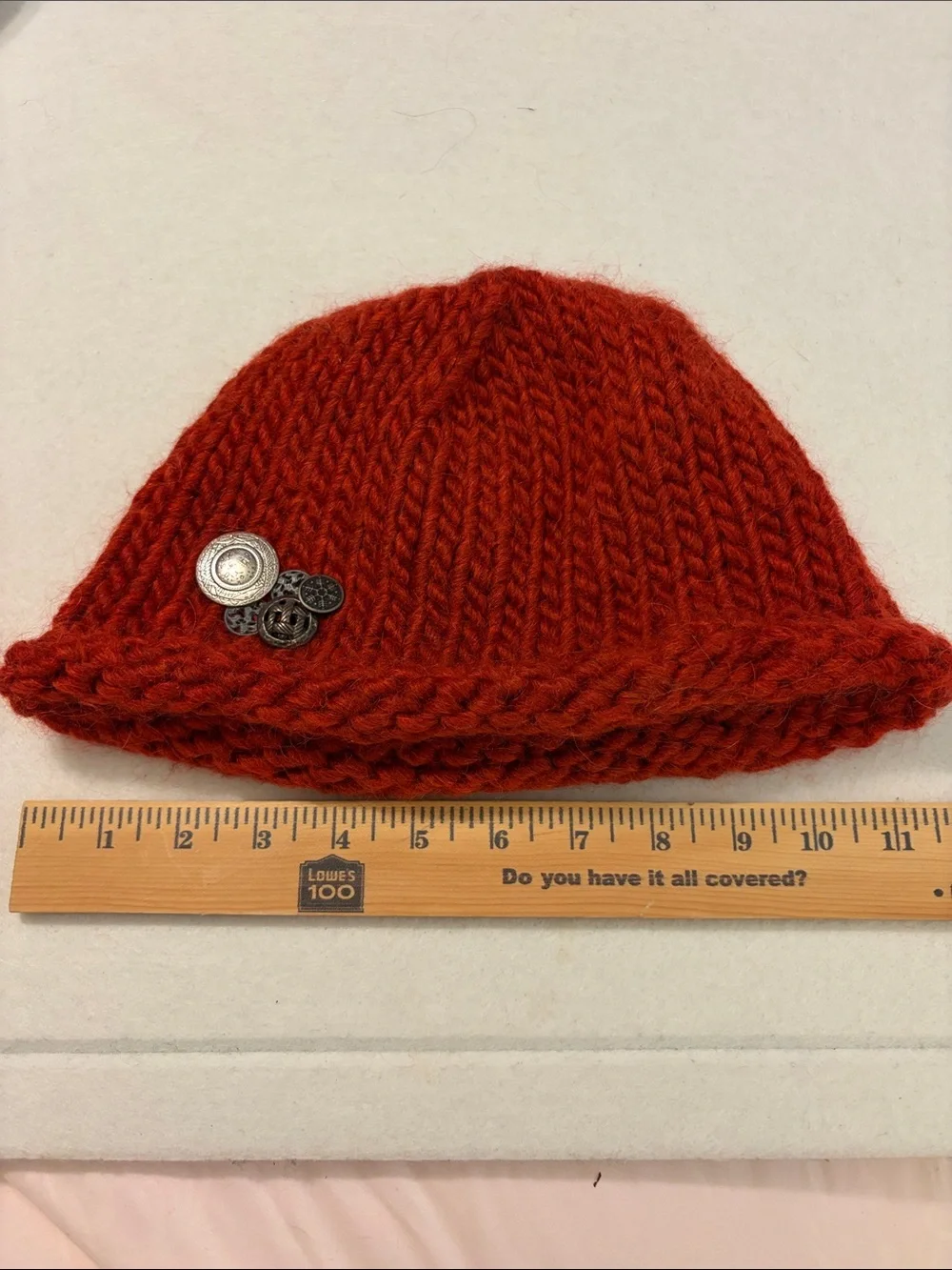 Handmade red beanie with metal buttons